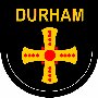 This is the Durham County badge, it is the cross of saint cuthbert, a local saint, the original badge was rectangular with a pale gold cross on black silk, it was changed to the shown badge on dark blue and then to todays colours of gold on black.