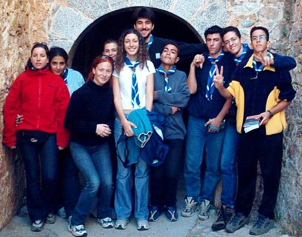 February 2003 Photo of the Month 18 Kbytes showing the Scouts in the standard group photo pose in front of a castle wall.